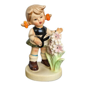 Little girl cutting flowers ceramic vintage figure
